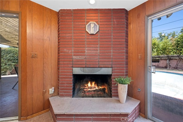 2415 N French St, Santa Ana, CA 92706 - detailed view of wood walls, carpet flooring, and a fireplace