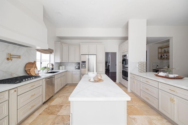 3044 Casmeg Way, El Cajon, CA 92019 - kitchen featuring appliances with stainless steel finishes, a kitchen island, tasteful backsplash, and light countertops