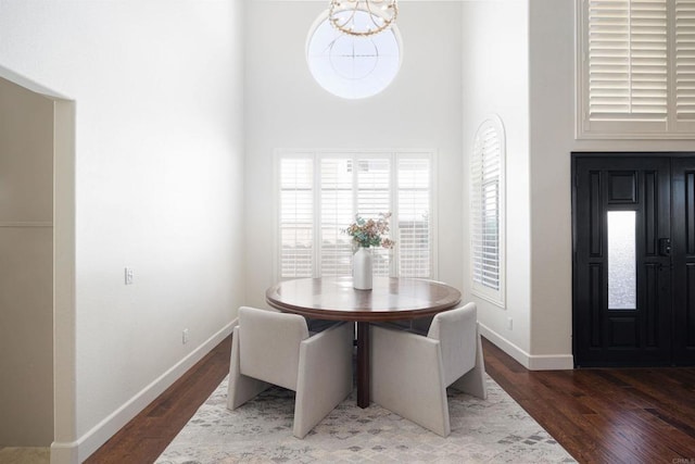 3044 Casmeg Way, El Cajon, CA 92019 - dining area featuring wood finished floors, a towering ceiling, and a chandelier