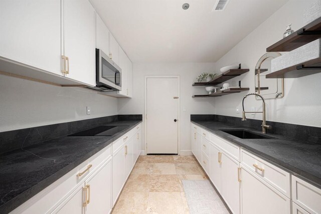 3044 Casmeg Way, El Cajon, CA 92019 - kitchen with open shelves, stainless steel microwave, black electric cooktop, and dark countertops