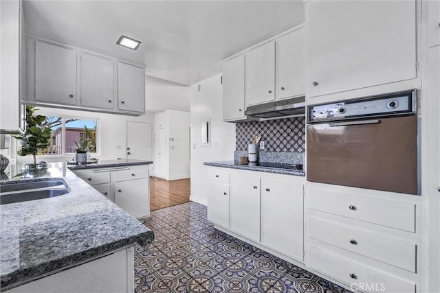 777 E Valley Blvd Unit 77, Alhambra, CA 91801 - kitchen with wall oven, under cabinet range hood, black electric stovetop, and white cabinets