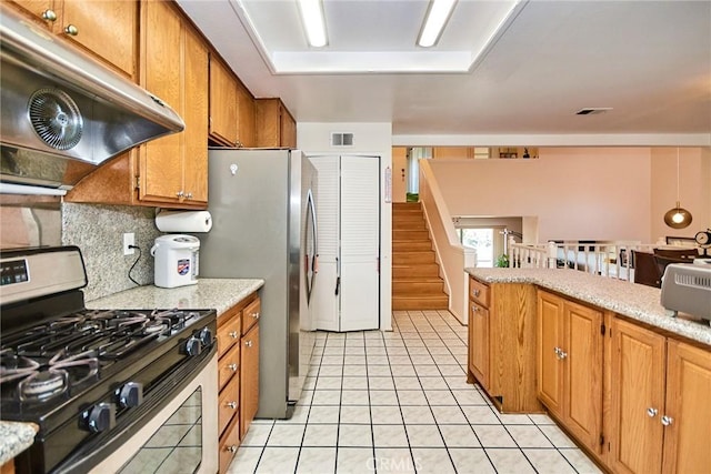 1144 Walnut Grove Ave Unit C, Rosemead, CA 91770 - kitchen featuring gas stove, under cabinet range hood, decorative backsplash, light tile patterned flooring, and brown cabinets