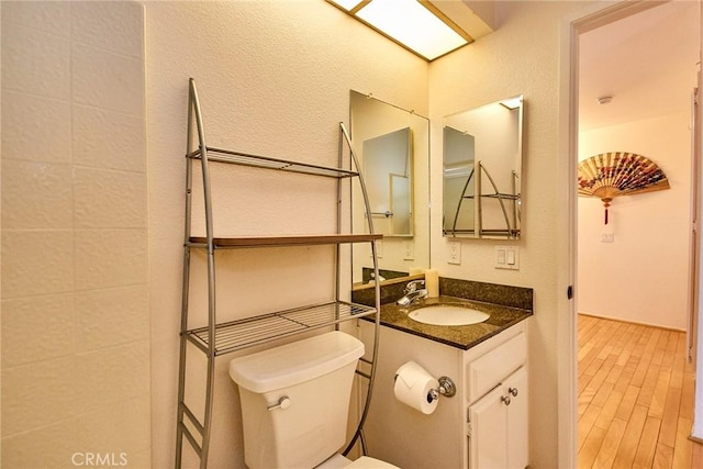 1144 Walnut Grove Ave Unit C, Rosemead, CA 91770 - bathroom featuring toilet, vanity, and wood finished floors