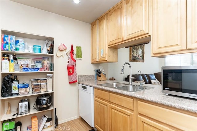 13100 Gilbert St Unit 28, Garden Grove, CA 92844 - kitchen with white dishwasher, stainless steel microwave, a sink, light brown cabinets, and recessed lighting
