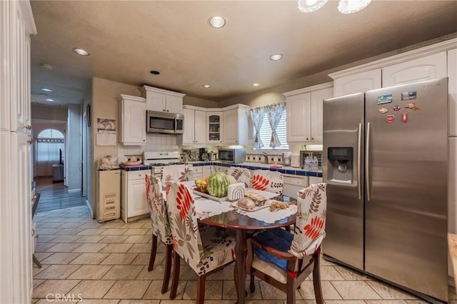 2613 E 221st St, Carson, CA 90810 - dining room with recessed lighting and light tile patterned floors