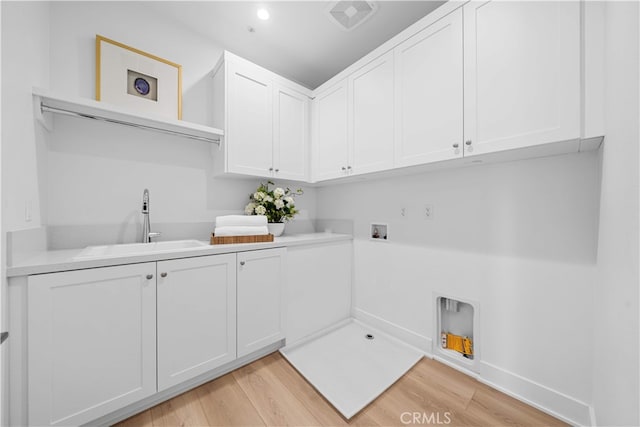 270 Maricopa, Irvine, CA 92618 - laundry room featuring cabinet space, washer hookup, hookup for an electric dryer, light wood-style flooring, and baseboards