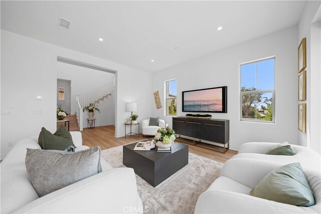 270 Maricopa, Irvine, CA 92618 - living area with plenty of natural light, stairway, light wood-style floors, and recessed lighting
