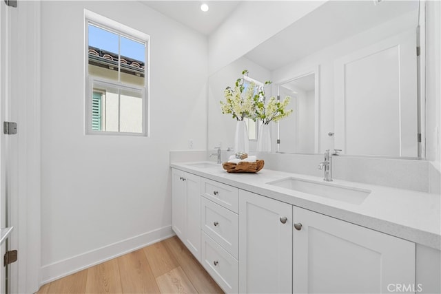 270 Maricopa, Irvine, CA 92618 - bathroom with baseboards, wood finished floors, double vanity, and recessed lighting