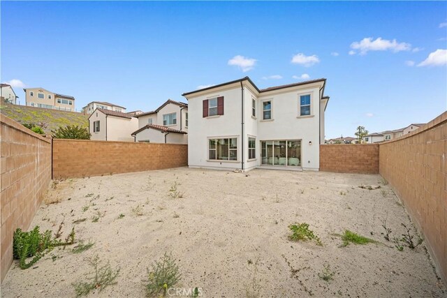 270 Maricopa, Irvine, CA 92618 - rear view of property featuring a fenced backyard, stucco siding, and a residential view