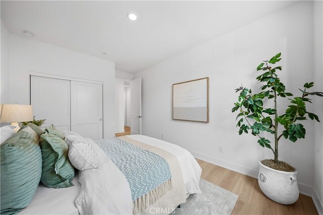 270 Maricopa, Irvine, CA 92618 - bedroom featuring wood finished floors, a closet, baseboards, and recessed lighting