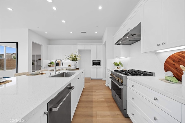 270 Maricopa, Irvine, CA 92618 - kitchen featuring stainless steel appliances, a sink, under cabinet range hood, recessed lighting, and white cabinets