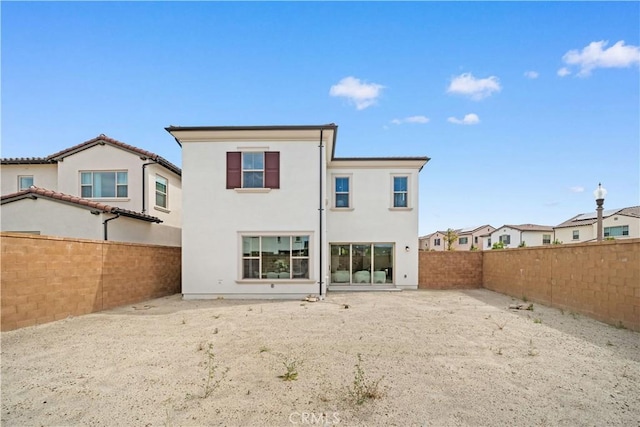 270 Maricopa, Irvine, CA 92618 - back of property featuring a fenced backyard and stucco siding