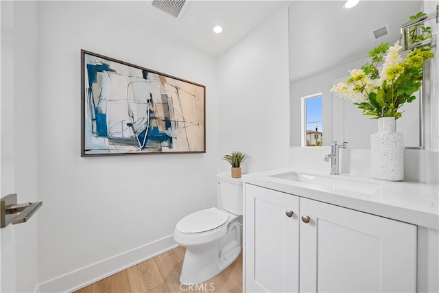 270 Maricopa, Irvine, CA 92618 - bathroom featuring wood finished floors, toilet, vanity, baseboards, and recessed lighting