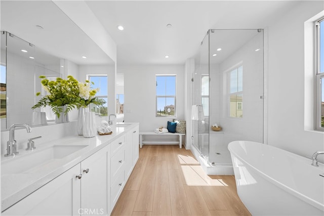270 Maricopa, Irvine, CA 92618 - full bath featuring a shower stall, recessed lighting, wood finished floors, a freestanding bath, and double vanity