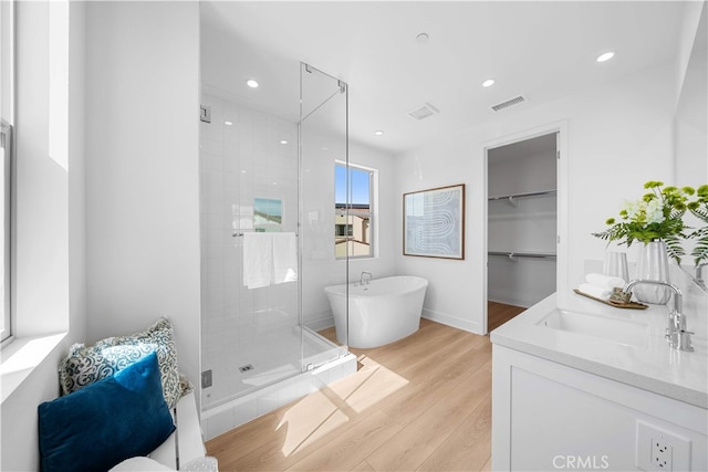 270 Maricopa, Irvine, CA 92618 - bathroom with a shower stall, wood finished floors, a freestanding bath, recessed lighting, and vanity