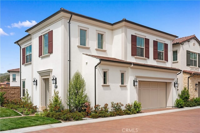 270 Maricopa, Irvine, CA 92618 - view of property with stucco siding and a garage