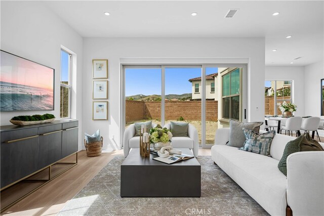 270 Maricopa, Irvine, CA 92618 - living area featuring healthy amount of natural light, wood finished floors, and recessed lighting
