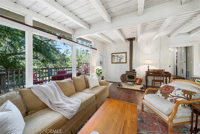 1359 Berwick Dr, Cambria, CA 93428 - living room featuring a wood stove, hardwood / wood-style floors, and beam ceiling
