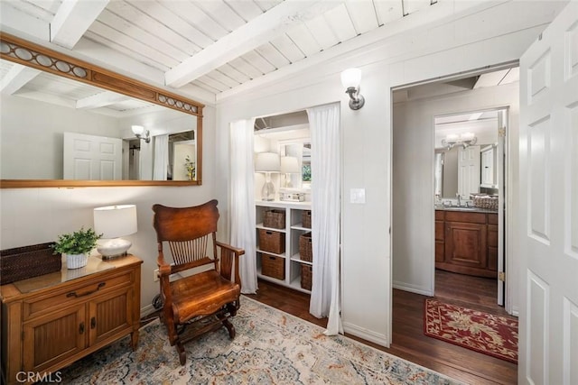 1359 Berwick Dr, Cambria, CA 93428 - living area featuring wood finished floors, beamed ceiling, and baseboards