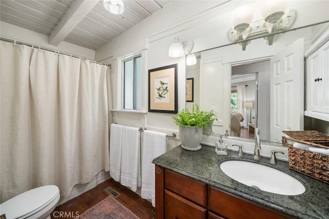 1359 Berwick Dr, Cambria, CA 93428 - full bath with wood ceiling, vanity, beamed ceiling, wood finished floors, and toilet