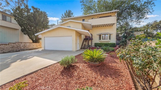 7948 Glenties Way, Sunland, CA 91040 - view of front of house featuring stucco siding, concrete driveway, and an attached garage