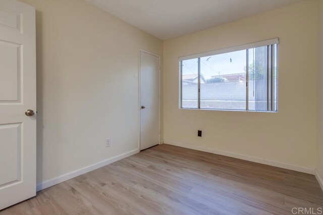 5019 Havenwood Ave, San Diego, CA 92120 - unfurnished room with light wood-style floors and baseboards