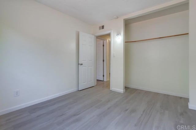 5019 Havenwood Ave, San Diego, CA 92120 - unfurnished bedroom with wood finished floors, baseboards, and a closet