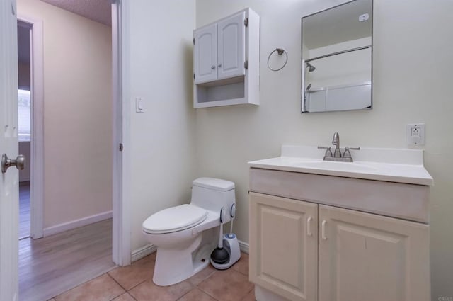 5019 Havenwood Ave, San Diego, CA 92120 - full bathroom featuring toilet, vanity, tile patterned flooring, and baseboards