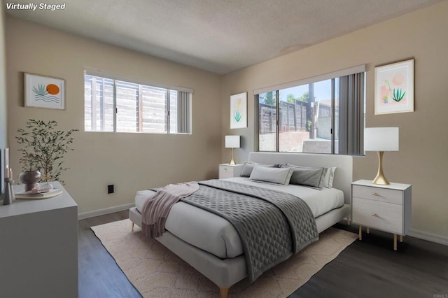 5019 Havenwood Ave, San Diego, CA 92120 - bedroom featuring multiple windows, wood finished floors, and baseboards