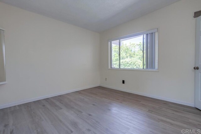 5019 Havenwood Ave, San Diego, CA 92120 - spare room featuring wood finished floors and baseboards
