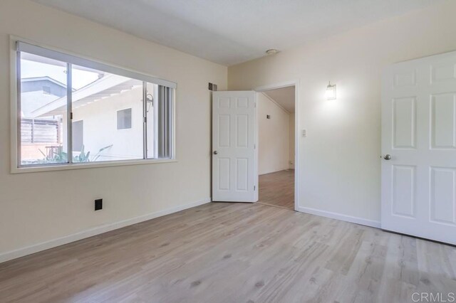 5019 Havenwood Ave, San Diego, CA 92120 - unfurnished bedroom featuring wood finished floors and baseboards