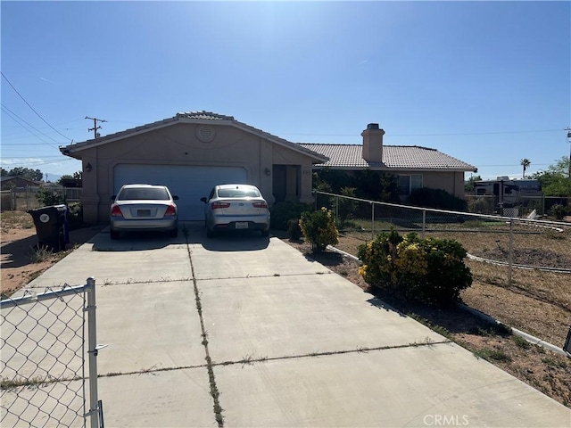 14842 Temecula Rd, Apple Valley, CA 92307 - ranch-style home with driveway, an attached garage, fence, and a chimney