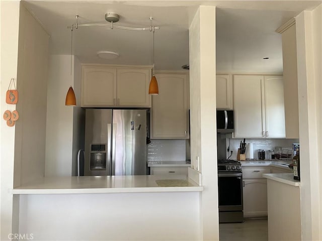6301 Coldwater Canyon Ave Unit 13, North Hollywood, CA 91606 - kitchen featuring stainless steel appliances, a peninsula, tasteful backsplash, and light countertops