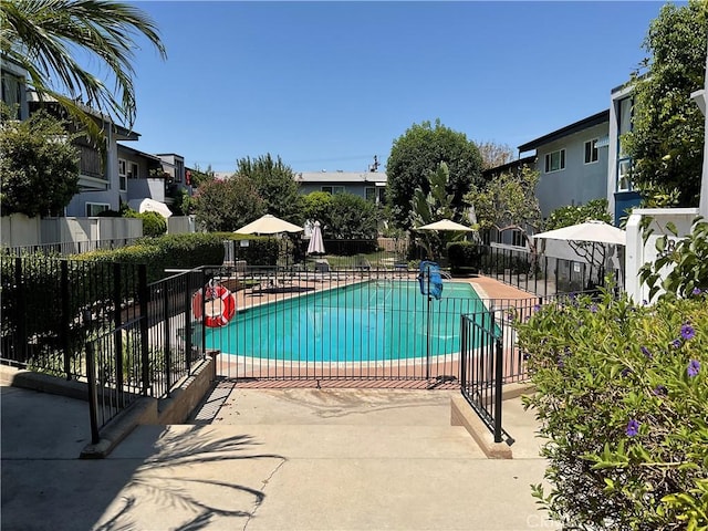 6301 Coldwater Canyon Ave Unit 13, North Hollywood, CA 91606 - community pool featuring fence, a patio, and a residential view