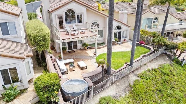 64 Camino, San Jose, San Clemente, CA 92672 - back of house featuring a tile roof, a patio, a fenced backyard, and stucco siding