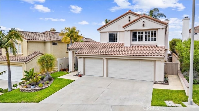 64 Camino, San Jose, San Clemente, CA 92672 - mediterranean / spanish-style house featuring concrete driveway, stucco siding, a tile roof, and an attached garage
