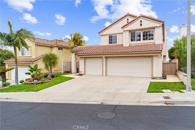 64 Camino, San Jose, San Clemente, CA 92672 - mediterranean / spanish house featuring stucco siding, fence, concrete driveway, and a tiled roof