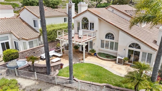 64 Camino, San Jose, San Clemente, CA 92672 - rear view of house featuring a patio area, a tiled roof, stucco siding, a chimney, and a wooden deck