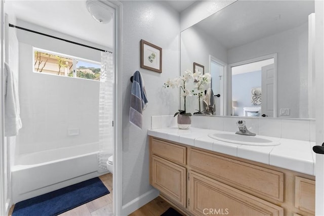 64 Camino, San Jose, San Clemente, CA 92672 - bathroom featuring toilet, wood finished floors, vanity, and shower / tub combination