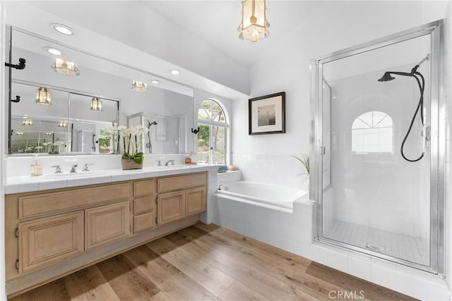 64 Camino, San Jose, San Clemente, CA 92672 - bathroom with a shower stall, a bath, wood finished floors, double vanity, and vaulted ceiling