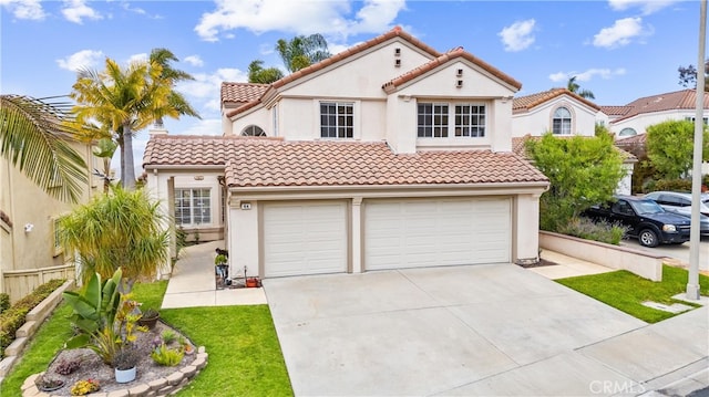 64 Camino, San Jose, San Clemente, CA 92672 - mediterranean / spanish house with concrete driveway, a tiled roof, stucco siding, and a garage