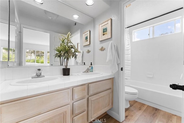 64 Camino, San Jose, San Clemente, CA 92672 - full bathroom featuring toilet, wood finished floors, double vanity, shower / bath combo, and recessed lighting