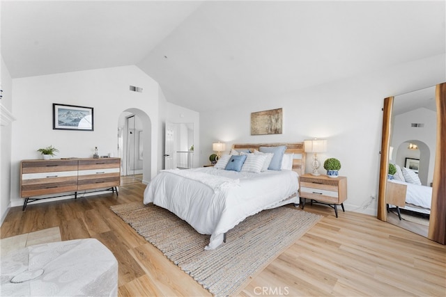 64 Camino, San Jose, San Clemente, CA 92672 - bedroom with arched walkways, lofted ceiling, and wood finished floors
