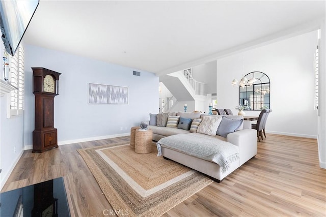 64 Camino, San Jose, San Clemente, CA 92672 - living area with light wood-style flooring, a chandelier, and baseboards