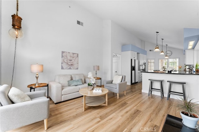 64 Camino, San Jose, San Clemente, CA 92672 - living room with high vaulted ceiling and light wood-style floors