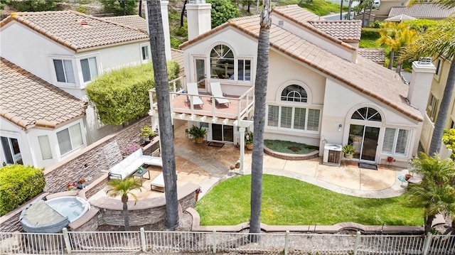 64 Camino, San Jose, San Clemente, CA 92672 - back of house with stucco siding, a patio, a chimney, and a tiled roof