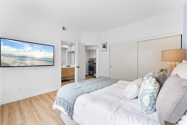 64 Camino, San Jose, San Clemente, CA 92672 - bedroom with light wood-style flooring, a closet, baseboards, and connected bathroom