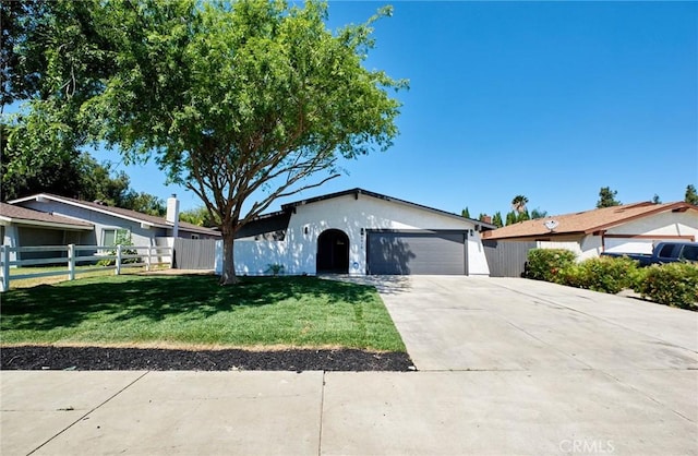 4474 Bartel Dr, Riverside, CA 92503 - ranch-style house featuring a garage, driveway, and stucco siding