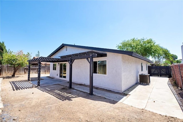 4474 Bartel Dr, Riverside, CA 92503 - view of front of house featuring a patio, a pergola, a fenced backyard, and stucco siding