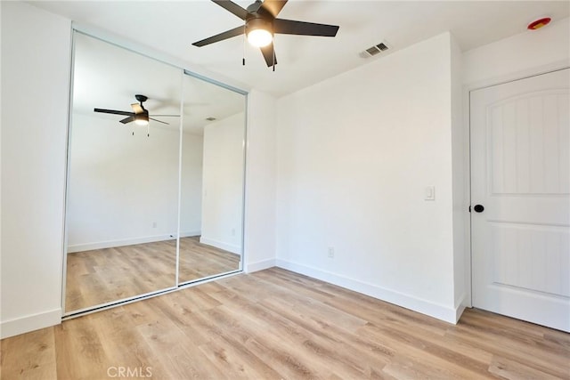 4474 Bartel Dr, Riverside, CA 92503 - unfurnished bedroom featuring light wood finished floors, a closet, baseboards, and ceiling fan